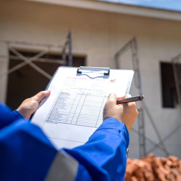 istock An architect is checking on house building quality checklist. 2170291916