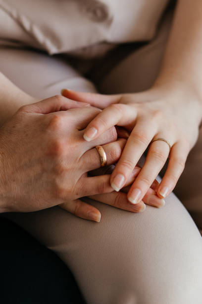 istock mother and daughter's hands together 2170296185