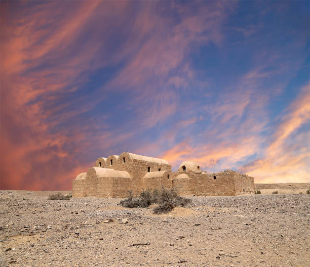 istock Quseir (Qasr) Amra desert castle (against the sky with clouds) near Amman, Jordan 2170297353