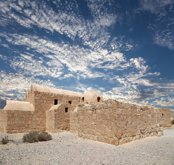 istock Quseir (Qasr) Amra desert castle (against the sky with clouds) near Amman, Jordan 2170297362