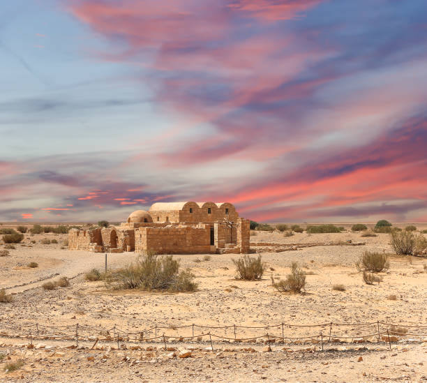 istock Quseir (Qasr) Amra desert castle (against the sky with clouds) near Amman, Jordan 2170297567