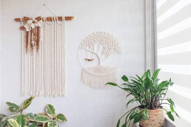 istock Macrame Wall hanging  on white wall. ECO friendly modern knitting DIY natural decoration concept in the interior. Handmade 100% cotton. Female hobby. 2170298001
