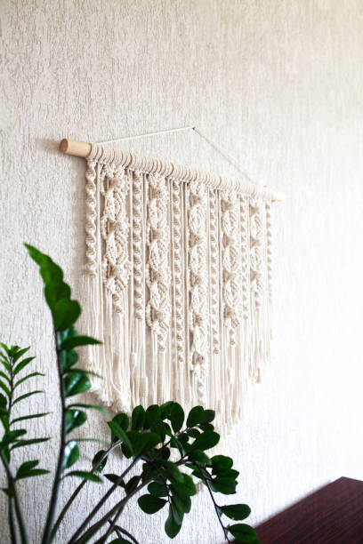 istock Close-up of hand made macrame texture pattern. ECO friendly modern knitting DIY natural decoration concept in the interior. Handmade 100% cotton, female hobby. 2170298103