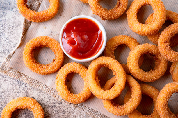 istock Fried onion rings with mozzarella or plain. Delicious onion rings on table 2170298807