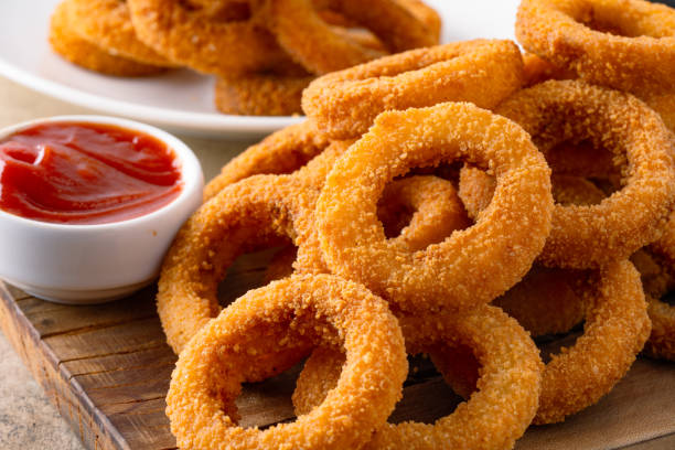istock Fried onion rings with mozzarella or plain. Delicious onion rings on table 2170298921