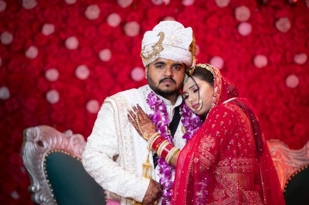 istock A couple dressed in traditional Indian wedding attire. 2170301431