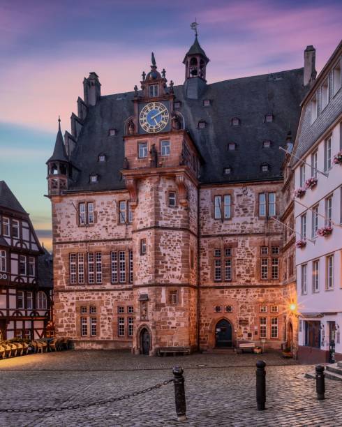istock Historic town hall with a clock tower in Marburg, Germany, during sunset 2170301923
