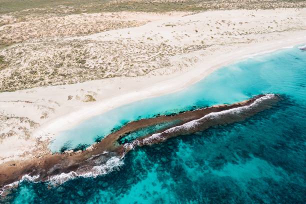 istock View of a pristine beach with turquoise waters and white sandy shores. 2170302050