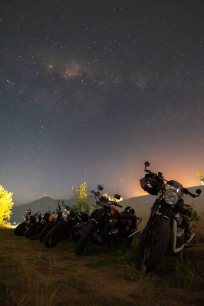istock Row of motorcycles parked under a starry night sky with the Milky Way visible 2170302586