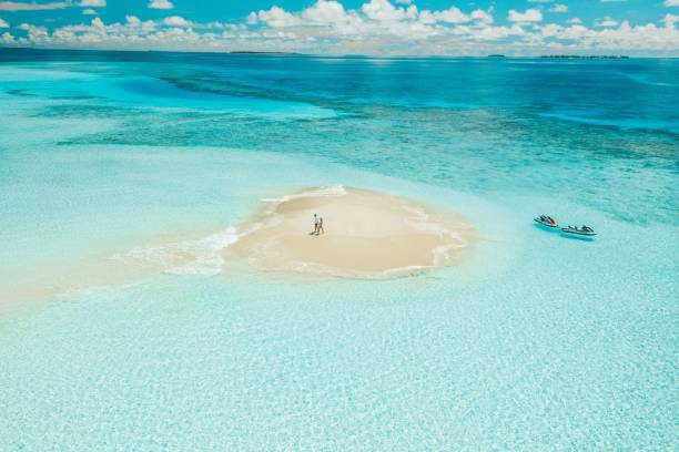 istock A couple standing on a small sandy island 2170302864
