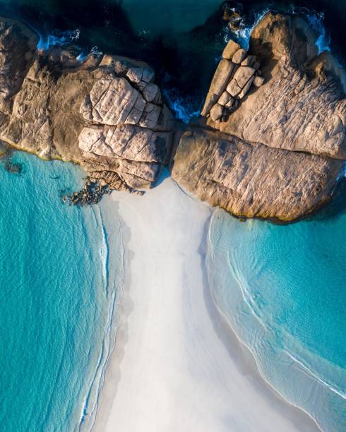 istock Aerial view of a pristine beach with rocky formations 2170303378