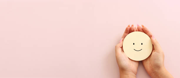 istock Concept image of satisfaction level. wooden cube with happy face 2170304120
