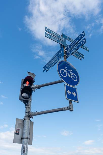 istock Street signs and traffic lights under a blue sky 2170304590
