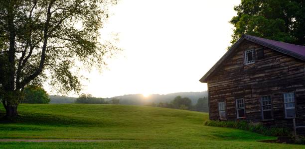 istock Countryside landscape with rustic barn at sunrise. 2170304760