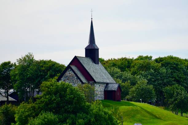 istock Picturesque stone church surrounded by greenery 2170305250