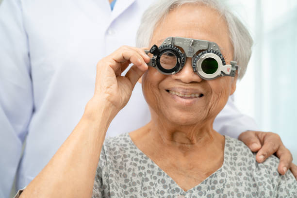 istock Asian senior woman wearing ophthalmic vision eye test and using optical trial frame. 2170305569