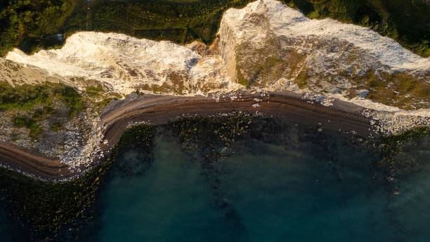 istock Aerial view of rugged coastline with white cliffs and clear blue water. 2170306210