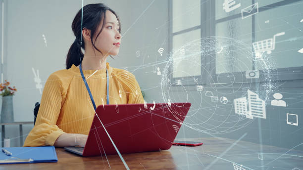 istock Working asian woman and communication network. Smart office. IoT (Internet of Things). Telecommunication. 2170307305