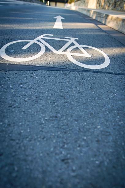 istock Bicycle lane symbol on a paved road 2170307693