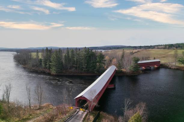 istock Aerial view of a red covered bridge over a river 2170308424