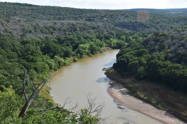 istock Scenic river view with lush green forests and hills. 2170308582