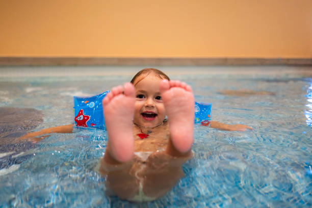 Little girl enjoys running towards the sea to go swimming