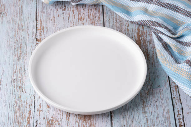 istock Empty plate on blue wooden background 2170313724