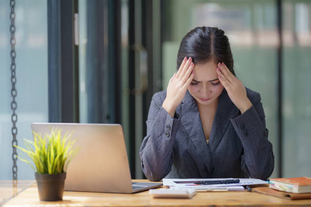 istock Seriously, a young woman working with paperwork and a digital tablet in the office. 2170314777