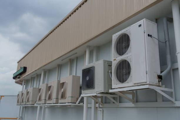 istock Air compressor or air condenser unit located on support outside building to heat released transferred to surrounding environment, Compressor is part of cooling function and air conditioning HVAC syste 2170317821