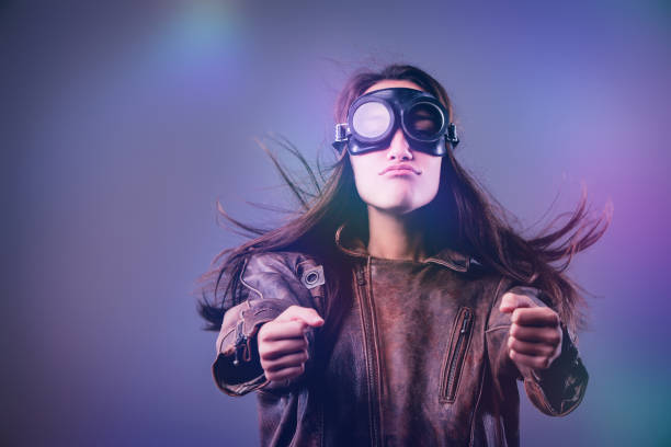 istock Young woman with goggles and leather jacket making a funny face 2170318218