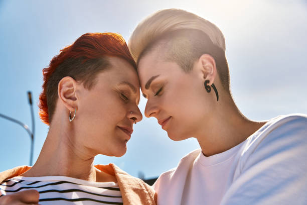 istock A joyful afternoon embrace between two young women in a sunlit urban setting 2170321463