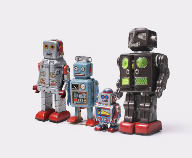 istock Funny cute tin toy robots on white background 2170325403
