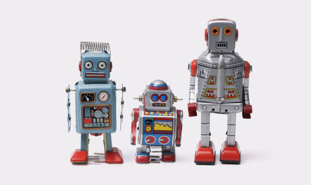 istock Funny cute tin toy robots on white background 2170325538