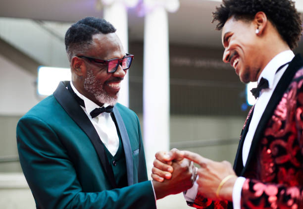 istock Happy celebrities greeting each other at event 2170327463