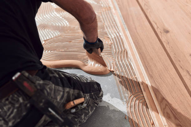 istock Professional handyman installing laminate flooring in a new apartment. 2170332591