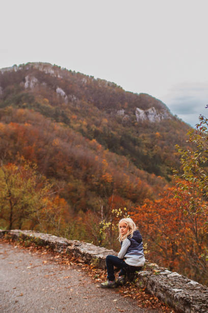istock Little blond in autumn in the mountains 2170333463