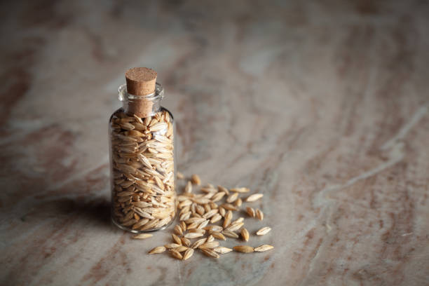 istock A small glass bottle filled with organic Barley (Hordeum Vulgare). 2170333698