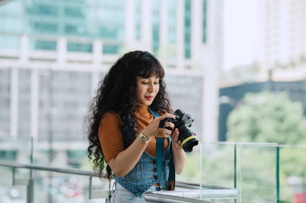 istock Asian Malay female with camera in city. 2170334363