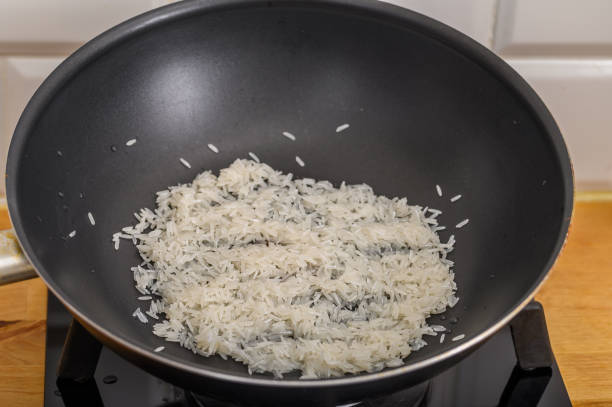 istock White rice fried in a pan, wok with rice 2170338686