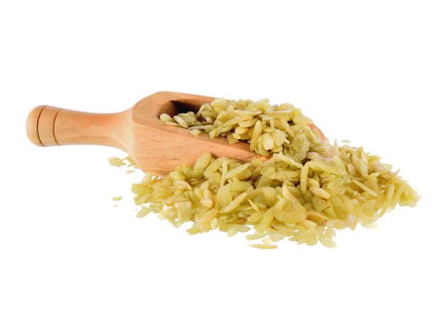 istock Shredded rice grain in scoop on white background 2170341212