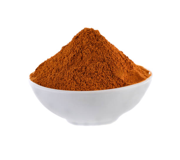 istock Cinnamon powder in white  bowl on white background 2170341476