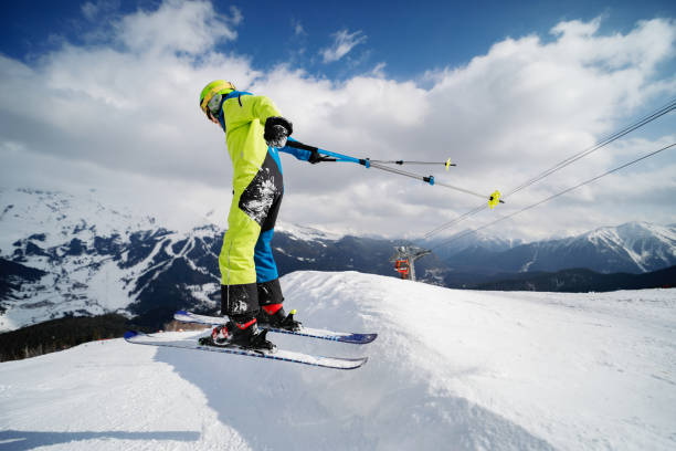 Teenage boy skiing in mountain