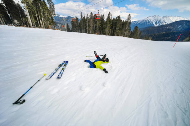 Teenage boy skiing in mountain, playing and having fun