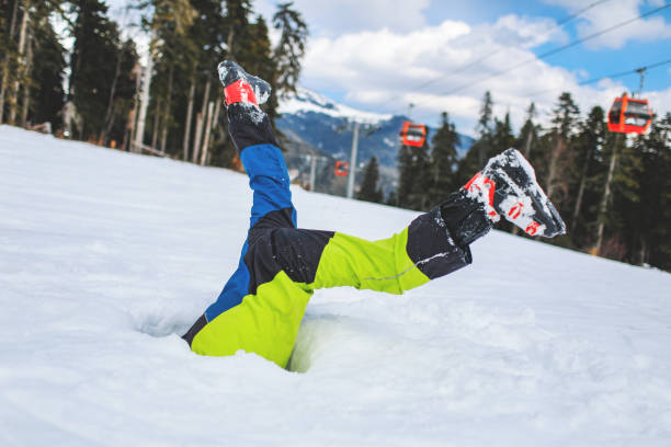 10 age boy in snow hole upside down