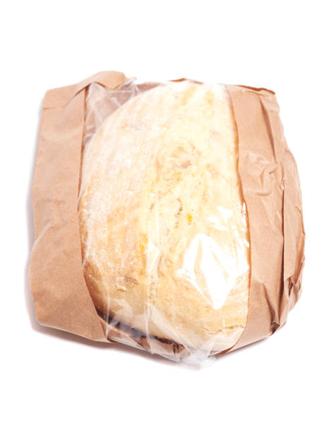 istock White bread in a paper bag isolated on white background. 2170342951