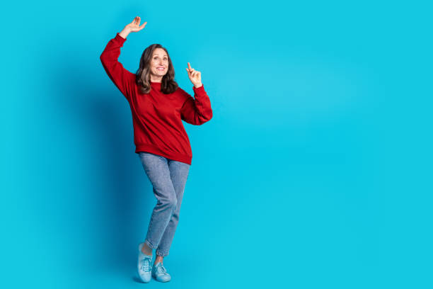 istock Full size photo of pretty aged lady dance empty space wear pullover isolated on blue color background 2170343404