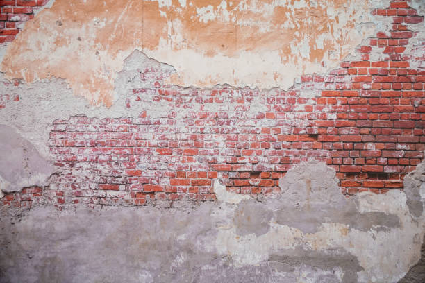 istock A white brick and orange brick wall. A orange painted old brick wall background 2170344535