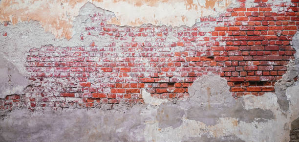 istock A white brick and orange brick wall. A orange painted old brick wall background 2170344546
