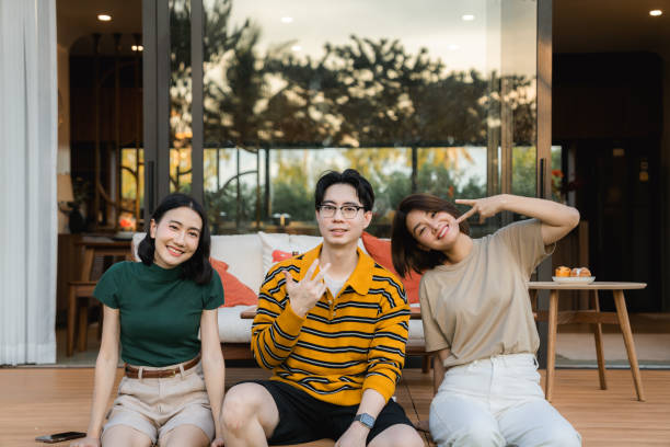 istock Group of asian friends talking and laughing while sharing funny stories 2170346437