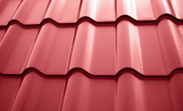 istock Close-up view lightweight steel roofing sheet. Red color coated modular tile effect roof panel. Traditional metal shingle tiles. Popular profiled metallic pantile mimic clay or concrete slate 2170346689